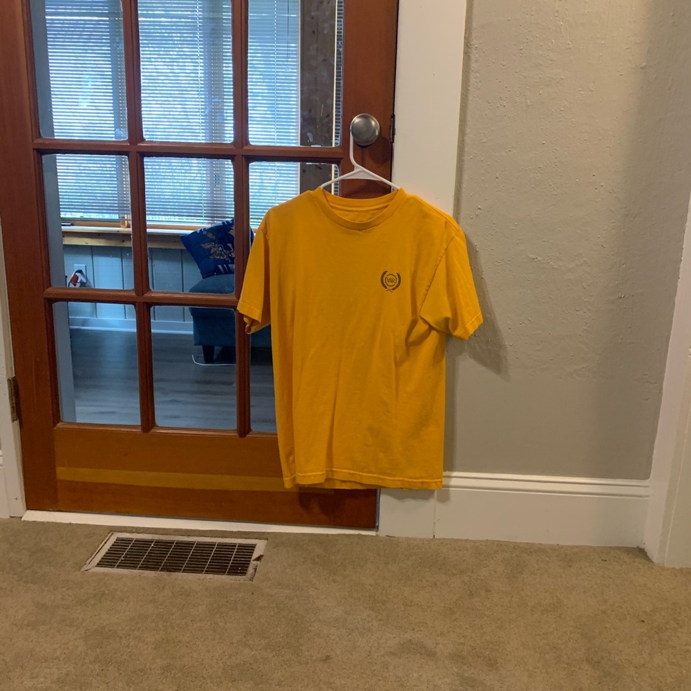A yellow young and reckless tshirt